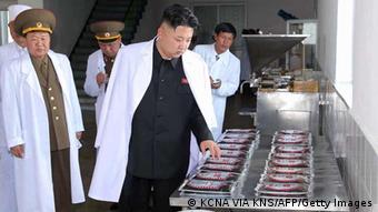 This undated picture, released from North Korea's official Korean Central News Agency (KCNA) on May 17, 2013 shows North Korean leader Kim Jong Un (C) inspecting the February 20 factory of the Korean People's Army (KPA), producing varieties of foodstuff at undisclosed place in North Korea. AFP PHOTO / KCNA via KNS
THIS PICTURE WAS MADE AVAIALBLE BY A THIRD PARTY. AFP CAN NOT INDEPENDENTLY VERIFY THE AUTHENTICITY, LOCATION, DATE AND CONTENT OF THIS IMAGE. THIS PHOTO IS DISTRIBUTED EXACTLY AS RECEIVED BY AFP.
---EDITORS NOTE--- RESTRICTED TO EDITORIAL USE - MANDATORY CREDIT AFP PHOTO / KCNA VIA KNS - NO MARKETING NO ADVERTISING CAMPAIGNS - DISTRIBUTED AS A SERVICE TO CLIENTS (Photo credit should read KNS/AFP/Getty Images)