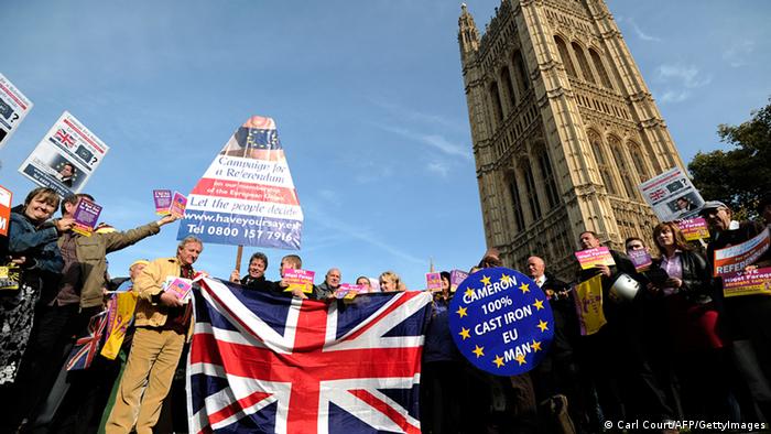 United Kingdom Independence Party (UKIP) supporters hold Union Jack flags and placards as they take part in a demonstration outside the Houses of Parliament in central London on October 24, 2011, the day that Parliament votes on whether to hold a referendum on the UK's membership of the European Union. David Cameron faced the biggest rebellion of his premiership today as eurosceptic backbenchers in his Conservative Party vowed to defy orders and vote for a referendum on Britain's EU membership. AFP PHOTO/ CARL COURT (Photo credit should read CARL COURT/AFP/Getty Images) 