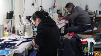 Chinese factory workers sew swim suits near the Italian coastal city of Rimini