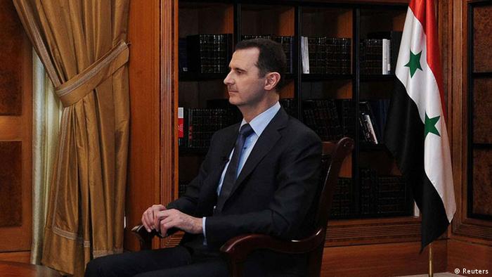 Syria's President Bashar al-Assad (R) sits during an interview with journalists from Argentina in Damascus in this handout photograph distributed by Syria's national news agency SANA on May 18, 2013. SANA/Handout via Reuters (SYRIA - Tags: POLITICS CONFLICT CIVIL UNREST MEDIA) ATTENTION EDITORS - THIS IMAGE WAS PROVIDED BY A THIRD PARTY. FOR EDITORIAL USE ONLY. NOT FOR SALE FOR MARKETING OR ADVERTISING CAMPAIGNS. THIS PICTURE IS DISTRIBUTED EXACTLY AS RECEIVED BY REUTERS, AS A SERVICE TO CLIENTS