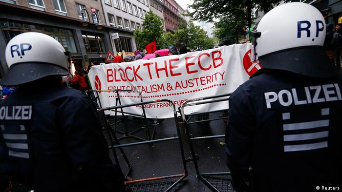 Police stand guard during an anti-capitalist Blockupy demonstration near the European Central Bank (ECB) headquarters in Frankfurt, (Photo: Reuters)