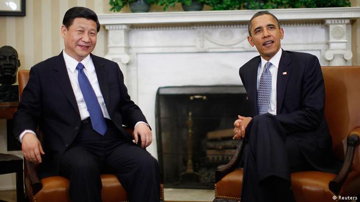U.S. President Barack Obama (R) meets with China's Vice President Xi Jinping in the Oval Office of the White House in Washington, in this February 14, 2012 file photo. China will be attempting to meet charm with charm for the first time when new President Xi Jinping sheds his suit and tie for an unprecedented, informal summit with U.S. President Barack Obama in the California desert the week of June 3, 2013. REUTERS/Jason Reed/Files (UNITED STATES - Tags: POLITICS)