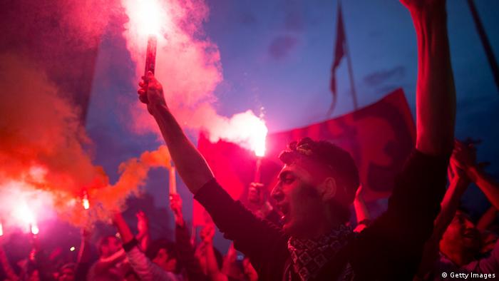 Protestors ligt torches in Taksim Square 
Photo by Uriel Sinai/Getty Images 
