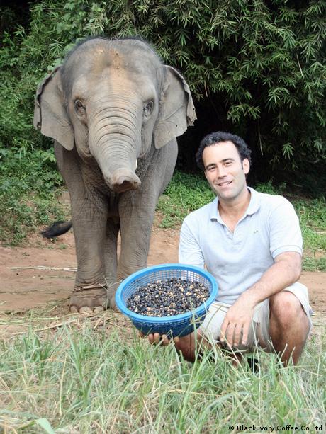Blake Dinkin with a bowl of coffee cherries picked from elephant dung in northern Thailand