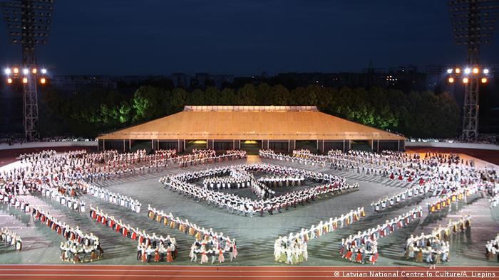 Dancers perform in a stadium in Riga during the Latvian Nationwide Song and Dance Celebration in 2008. (Photo A. Liepins)