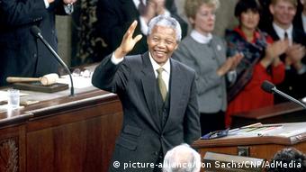 Nelson Mandela acknowledges the applause he receives for a speech he made as president in 1994 Photo:: Ron Sachs/CNP/AdMedia 
