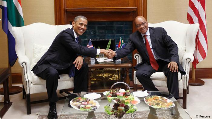 U.S. President Barack Obama (bottom L) and First Lady Michelle Obama (bottom R) are greeted by South Africa's President Jacob Zuma (top L)and his wife, First Lady Thobeka Madiba-Zuma (top right), at the Union Building in Pretoria June 29, 2013. Obama paid tribute to anti-apartheid hero Nelson Mandela as he flew to South Africa on Friday but played down expectations of a meeting with the ailing black leader during an Africa tour promoting democracy and food security. REUTERS/Gary Cameron (SOUTH AFRICA - Tags: POLITICS)
