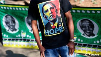 A man wears a t-shirt with a portrait of U.S. President Barack Obama outside the Medi-Clinic Heart Hospital where former South African President Nelson Mandela is being treated in Pretoria June 29, 2013. REUTERS/Kevin Coombs (SOUTH AFRICA - Tags: POLITICS TPX IMAGES OF THE DAY) HEALTH)
