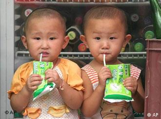 Two Chinese children drink breakfast milk at a store in Beijing Friday Aug. 26, 2005.  Government statistics show that 117 boys are born in China for every 100 girls.   Birth-control policies which limit many couples to only one child result in some female fetuses being aborted by parents who prefer boys. (AP Photo)