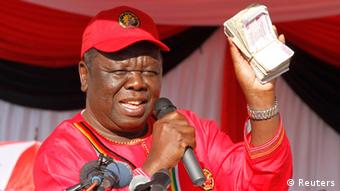 Zimbabwe opposition Movement For Democratic Change (MDC) leader Morgan Tsvangirai speaks at the launch of his party's election campaign in Marondera, about 70 km (43 miles) east of Harare, July 7, 2013. Tsvangirai, launching his third campaign to unseat veteran President Robert Mugabe, said nothing had been achieved to ensure a fairer vote but even God now wanted Mugabe to go. REUTERS/Philimon Bulawayo (ZIMBABWE - Tags: POLITICS ELECTIONS)
