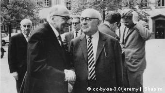 Horkheimer (front left) and Adorno in 1964; Habermas is at the back on the right, running his hand through his hair
