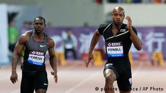 FILE - In this Saturday, May 19, 2013 file photo, Asafa Powell of Jamaica, center, competes with Nesta Carter of Jamaica, left, and Kim Collins of Saint Kitts, right, during the men's 100 meter at the Diamond League track and field competition in Shanghai, China. Former 100-meter world-record holder Asafa Powell and Jamaican teammate Sherone Simpson have each tested positive for banned stimulants, according to their agent. Paul Doyle told The Associated Press on Sunday, July 14, 2013 that they tested positive for the stimulant oxilofrine at the Jamaican championships and were just recently notified. The news came the same day that American 100-meter record holder Tyson Gay revealed that he also failed a drug test. (AP Photo/Eugene Hoshiko, File)
