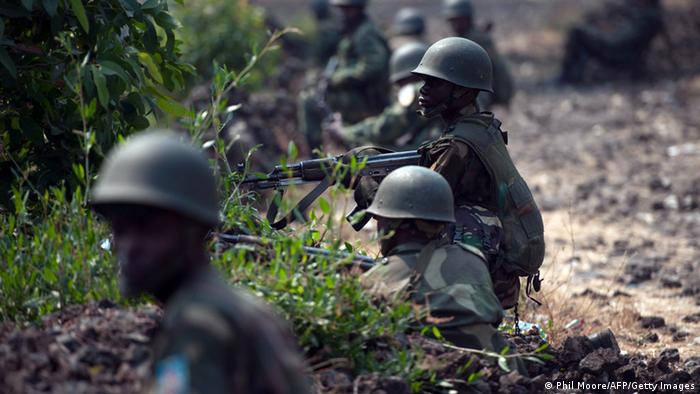 Congolese Army soldiers man a foward position in Kanyarucinya, some 12 kms from Goma, in the east of the Democratic Republic of the Congo on July 16, 2013. The army in the Democratic Republic of Congo on July 16 pursued an offensive against rebels of the M23 movement to protect the North Kivu provincial capital of Goma. M23, a movement launched by Tutsi defectors from the army who accuse the Kinshasa government of reneging on a 2009 peace deal, last year occupied Goma for 10 days before pulling out under international pressure. AFP PHOTO / PHIL MOORE (Photo credit should read PHIL MOORE/AFP/Getty Images) 