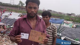 Myanmar's Rohingya refugee Mohammad Jakariya with his Burmese Id and new ID of UNHCR in a refugee camp in Delhi