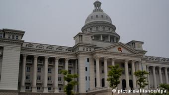 --FILE--View of a local court building, which resembles the Capitol in the United States, in Jiujiang city, east Chinas Jiangxi province, 16 May 2007. The State Council has ordered a nationwide inspection to find out if any new luxurious government buildings have been built since the new cabinet was installed in March. According to its urgent notification, the State Council ordered thorough checks to see whether central or local government agencies had used public funds to build extravagant offices, halls or guest houses. pixel