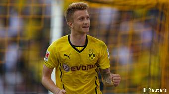 Borussia Dortmund's Marco Reus celebrates scoring a goal against Bayern Munich during their SuperCup 2013 soccer match in Dortmund July 27, 2013. Wolfgang Rattay (GERMANY - Tags: SPORT SOCCER) DFL RULES TO LIMIT THE ONLINE USAGE DURING MATCH TIME TO 15 PICTURES PER GAME. IMAGE SEQUENCES TO SIMULATE VIDEO IS NOT ALLOWED AT ANY TIME. FOR FURTHER QUERIES PLEASE CONTACT DFL DIRECTLY AT + 49 69 650050