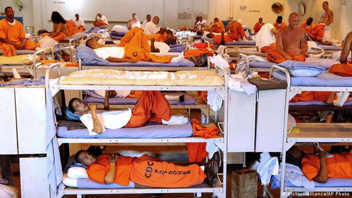 FILE - In this undated file photo released by the California Department of Corrections, inmates sit in crowded conditions at California State Prison in Los Angeles. The U.S. Supreme Court on Friday, Aug. 2, 2013 paved the way for the early release of nearly 10,000 prisoners by year's end despite warnings by Gov. Jerry Brown and other state officials that a public safety crisis looms if they're forced to open the prison gates. (AP Photo/California Department of Corrections, File)
