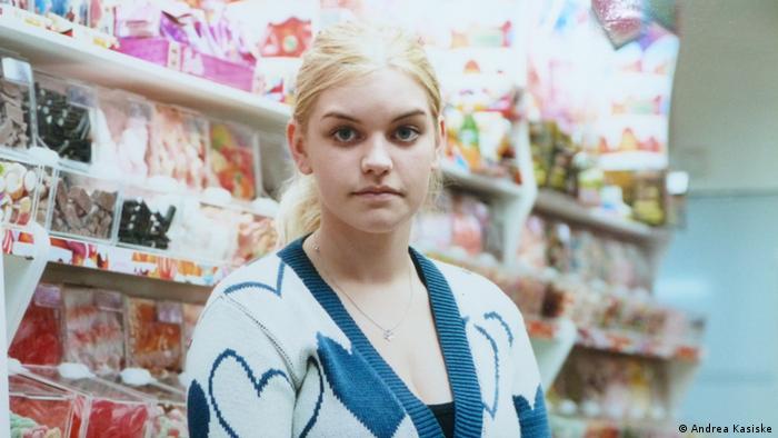 A young, blond saleswoman in a supermarket, part of the I am not afraid of anything photography exhibition by Edgar Zippel in Berlin's Museum for European Cultures, Copyright: Museum Europäischer Kulturen