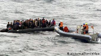 A boat of refugees in the water 