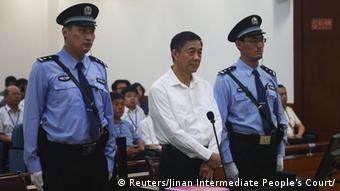 Disgraced Chinese politician Bo Xilai stands trial inside the court in Jinan, Shandong province August 22, 2013, in this photo released by Jinan Intermediate People's Court. Fallen Chinese politician Bo appeared in public for the first time in more than a year on Thursday to face trial in eastern China, the final chapter of the country's most politically charged case in more than three decades. REUTERS/Jinan Intermediate People's Court/Handout via Reuters (CHINA - Tags: POLITICS CRIME LAW TPX IMAGES OF THE DAY) ATTENTION EDITORS - THIS IMAGE WAS PROVIDED BY A THIRD PARTY. FOR EDITORIAL USE ONLY. NOT FOR SALE FOR MARKETING OR ADVERTISING CAMPAIGNS
