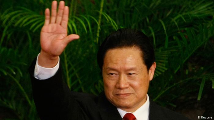 Then China's Politburo Standing Committee Member Zhou Yongkang waves during a meeting with the media at the Great Hall of the People in Beijing October 22, 2007. Few figures are as divisive in China as former domestic security tsar Zhou, reportedly under investigation by the ruling Communist Party for corruption. Even the once ambitious but now ousted politician Bo Xilai, whose trial on corruption ended on August 26, 2013, doesn't evoke the same depth of feeling that Zhou does. From the oil fields of frigid northeastern China, the hulking Zhou worked his way up to the elite Politburo Standing Committee, where his spending on domestic security exceeded the separate budgets for defence, healthcare or education. Picture taken October 22, 2007. To match story CHINA-POLITICS/ZHOU REUTERS/Jason Lee (CHINA - Tags: CRIME LAW POLITICS)