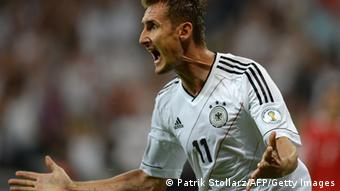 Germany's striker Miroslav Klose celebrates after scoring the 1-0 during the FIFA World Cup 2014 group C qualifying football match of Germany vs Austria on September 6, 2013 in Munich, southern Germany. AFP PHOTO / PATRIK STOLLARZ (Photo credit should read PATRIK STOLLARZ/AFP/Getty Images)