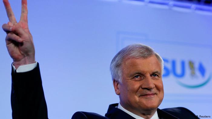Bavarian State Premier and leader of the Christian Social Union (CSU) Horst Seehofer gestures as he addresses his party members in Munich, September 15, 2013. Angela Merkel's allies swept to victory in a state poll in Bavaria on Sunday, winning enough support to regain the absolute majority they had lost in 2008 and boosting the chancellor and her conservatives a week before a German federal election. The Christian Social Union (CSU), sister party of Merkel's Christian Democrats (CDU), won 49 percent according to a TV exit poll. Their coalition partner, the Free Democrats (FDP), polled just 3 percent, crashing out of the state assembly. REUTERS/Michael Dalder (GERMANY - Tags: POLITICS ELECTIONS)
