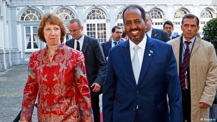 European Union foreign policy chief Catherine Ashton (L) and Somali's President Hassan Sheikh Mohamud (R) arrive at a conference called New Deal in Somalia in Brussels September 16, 2013. Somalia's government and international donors will sign up to a three-year plan on Monday to rebuild the violence-torn country, backed by pledges of new funding that EU officials hope could reach more than one billion euros. REUTERS/Yves Herman (BELGIUM - Tags: POLITICS BUSINESS)