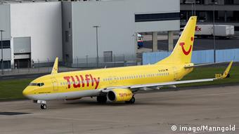A yellow TUIfly plane on a runway
Copyright: imago/Manngold
