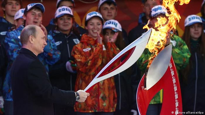 President of Russia Vladimir Putin torches the Olympic cauldron in Red Square thus giving a start to the Olympic Torch Relay. (Photo ITAR-TASS / Alexei Nikolsky)