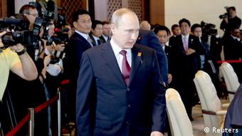 Russia's President Vladimir Putin arrives at the Leaders Retreat during the Asia-Pacific Economic Cooperation (APEC) Summit in Nusa Dua on the Indonesian resort island of Bali, October 7, 2013. REUTERS/Dita Alangkara/Pool (INDONESIA - Tags: POLITICS)