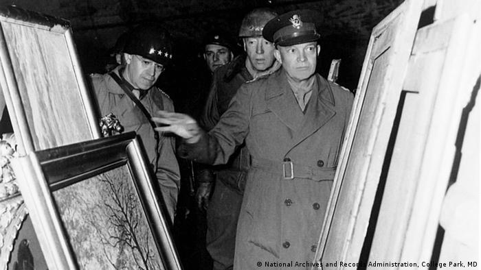 A black and white photo from 1945 with Lt. Gen. Omar N. Bradley, Lt. Gen. George S. Patton Jr., and Gen. Dwight D. Eisenhower as they inspect the German museum treasures stored in the Merkers mine. Photo: Walker Hancock Collection