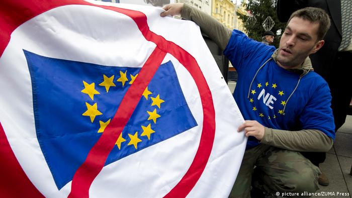 A man holds an anti-EU banner in Zagreb