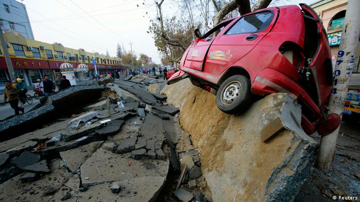 ATTENTION EDITORS - REUTERS PICTURE HIGHLIGHT TRANSMITTED BY 0535GMT ON NOVEMBER 23, 2013
PEK03
A wrecked car is seen lifted onto the side of a damaged road after an explosion in a Sinopec Corp oil pipeline in Huangdao, Qingdao, Shandong Province. REUTERS/Stringer CHINA OUT. NO COMMERCIAL OR EDITORIAL SALES IN CHINA.
REUTERS NEWS PICTURES HAS NOW MADE IT EASIER TO FIND THE BEST PHOTOS FROM THE MOST IMPORTANT STORIES AND TOP STANDALONES EACH DAY. Search for TPX in the IPTC Supplemental Category field or IMAGES OF THE DAY in the Caption field and you will find a selection of 80-100 of our daily Top Pictures.
REUTERS NEWS PICTURES. 
TEMPLATE OUT