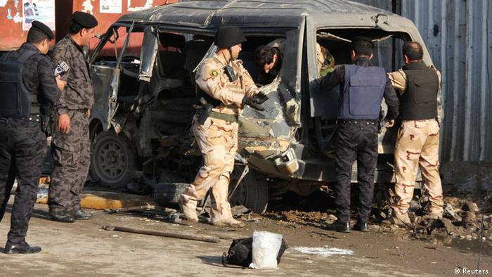 A bombed out mini-bus in Baghdad. Photo: Reuters