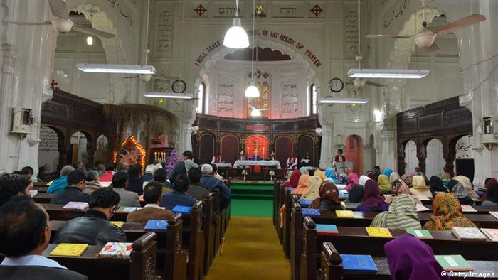 To go with Pakistan-unrest-northwest-Christmas,FOCUS by Damon WAKE Pakistani Christians, including members whose relatives were killed in the September 22 bomb blast at the All Saint's Church, participate in a service in Peshawar on December 22, 2013
(Photo: A Majeed/AFP/Getty Images) 