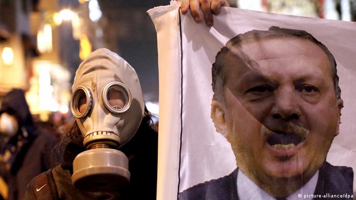 Person holding picture of Turkish Prime Minister Recep Tayyip Erdogan