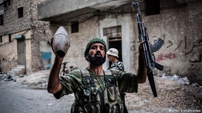 Aufständischer mit Waffen in Syrien (Foto: dpa)