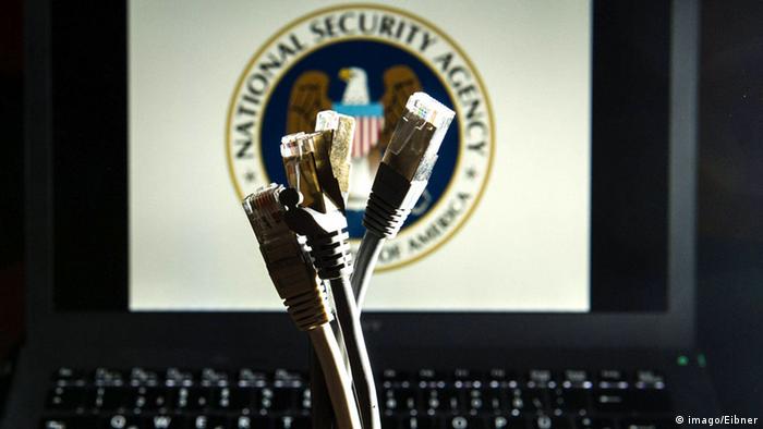 Network cables in front of a computer with the NSA emblem on the screen
Photo: imago/Eibner