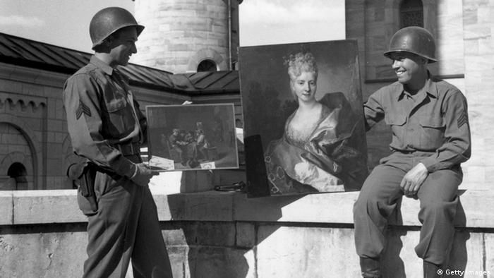 Black and white photo from 1945, showing that American soldiers found valuable paintings amongst a huge cache of art treasures hidden by the Nazis in Neuschwanstein Castle Photo: Getty images