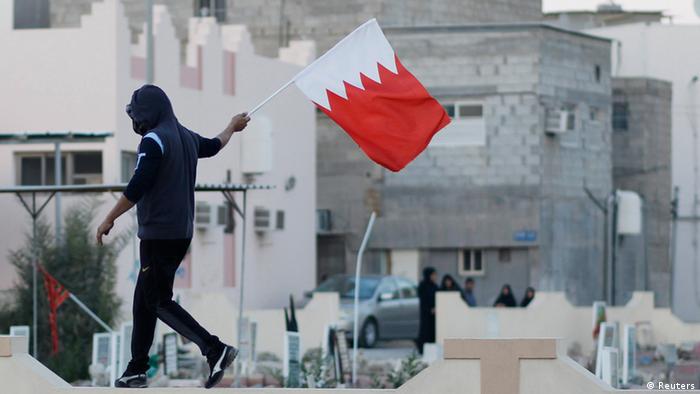 Bahrain protester with a flag