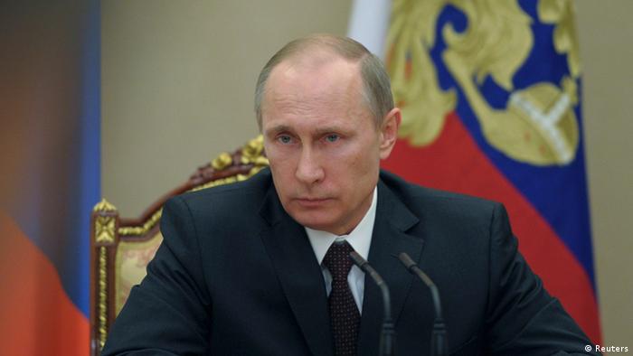 Putin, seated at Russian security council 21.03.2014 