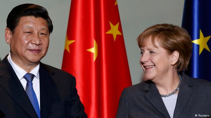 German Chancellor Angela Merkel and China's President Xi Jinping arrive for an agreement signing at the Chancellery in Berlin March 28, 2014. 