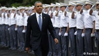 US President Obama walks past saluting cadets at West Point