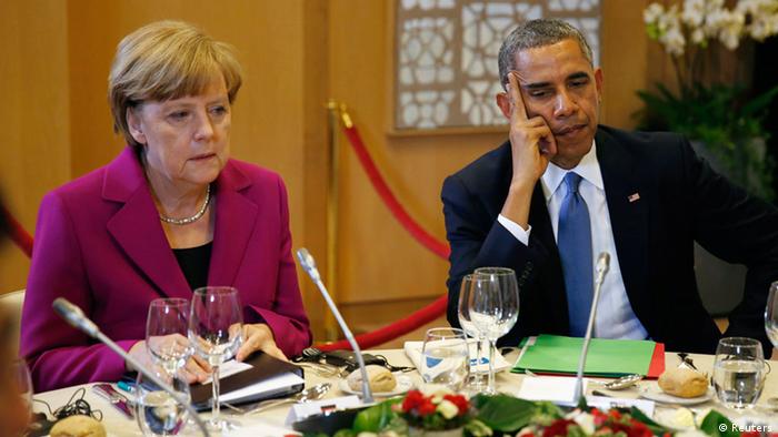 U.S. President Barack Obama and German Chancellor Angela Merkel listen during the G7 Summit working dinner in Brussels June 4, 2014. The world's leading industrialized nations meet without Russia for the first time in 17 years on Wednesday, leaving President Vladimir Putin out of the talks in retaliation for his seizure of Crimea and Russia's part in destabilizing eastern Ukraine. REUTERS/Kevin Lamarque 
