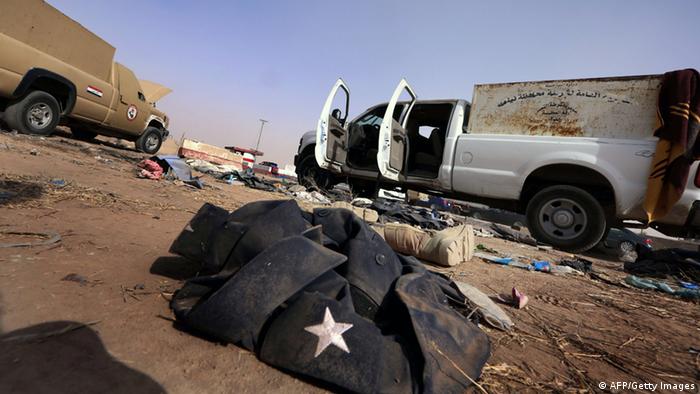 A jacket and boots belonging to the Iraqi security forces litter the ground at the Kukjali Iraqi Army checkpoint
Photo: SAFIN HAMED/AFP/Getty Images