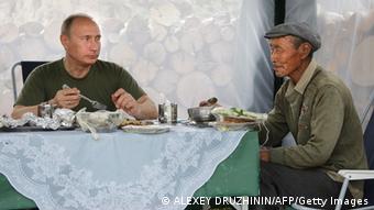 Putin eating dinner