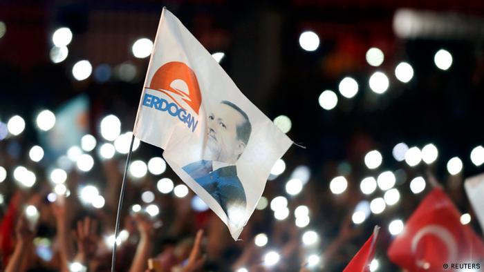  A flag with the picture of Turkey's Prime Minister Tayyip Erdogan is seen during celebrations of his election victory in front of the party headquarters in Ankara August 10, 2014. Erdogan secured his place in history as Turkey's first directly elected president on Sunday, sweeping more than half the vote in a result his opponents fear heralds an increasingly authoritarian state. (photo: REUTERS/Umit Bektas)