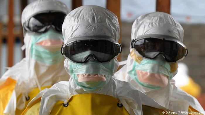 Medical personnel in protective suits  Photo: DOMINIQUE FAGET/AFP/Getty Images