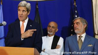 US Secretary of State John Kerry, from left, speaks as Afghan presidential candidates Ashraf Ghani Ahmadzai and Abdullah Abdullah listen during a joint press conference in Kabul
(AP Photo/Rahmat Gul, File)